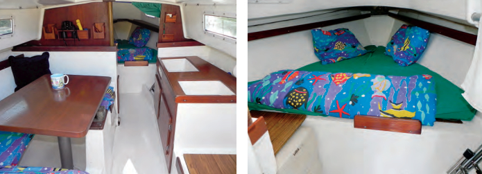 Teak trim and laminates soften the cold whiteness of the molded fiberglass pan and headliner, at left. The trunk for the swing keel is easily visible but it’s not as intrusive as it might seem. A portable toilet can be fitted between the main bulkhead and the V-berth, at right.