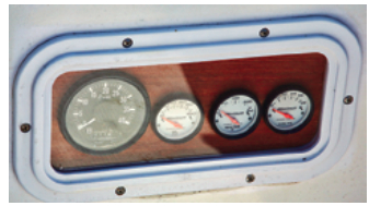 The engine instruments are protected behind a Beckson fixed port mounted in the face of the bridge deck where they are clearly visible from the helm.