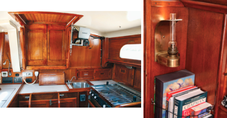 Song’s galley retains its classic 1970s look, at left, accented by modern electronic devices like the chart plotter on its swing-out bracket. Jim Stedman further enhanced the atmosphere with kerosene lamps, at right.
