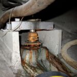 The lag screws that secured the bearing to its block had corroded, allowing the bearing to rise up the rudder stock. The weldment is for the rudder stops.