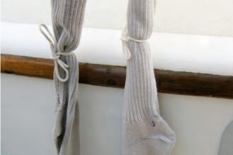 Old socks protect Marilyn’s brightwork and gelcoat from dings from the turnbuckles and the turnbuckles from dirt.