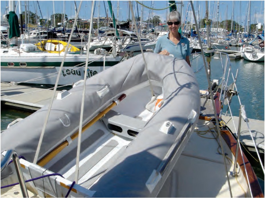 Jane with the dinghy in its newly completed cover, April 2007, in Queensland, Australia.