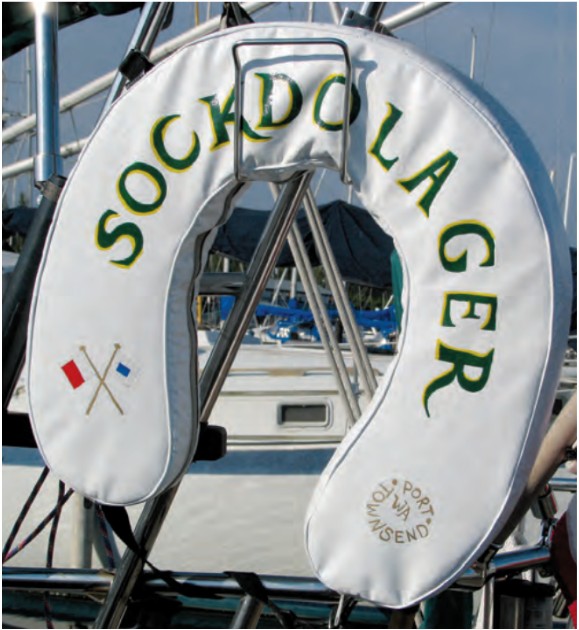 Safety regulations require boats to carry throwable flotation devices but are silent on their color or decoration. Karen used the loophole to artistic advantage.