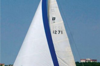 The Pearson 26, Pied Piper, owned by Bill Snow, heels to a fine sailing breeze on Oklahoma’s Grand Lake O’ the Cherokees.