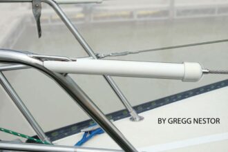 A rigid cover over a lifeline turnbuckle protects sails against chafe and from being snagged by cotter pins or rings.