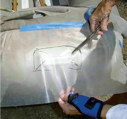 The first step in making a pattern is to mark the cutouts. Their initial outlines will only be approximate, since the clear-plastic pattern material is not flat when it is marked.