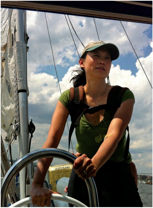 Serena wearing the baby backpack at the helm of Wildest Dream.