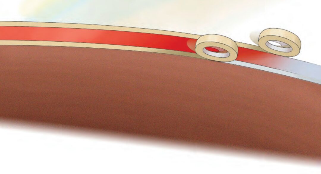 Barbara protected the white reveal stripe by taping over it. She also taped above the red boot stripe to isolate it. On the same day, she painted two places: the red boot stripe and the bottom paint.