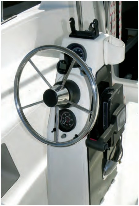 All 26X models have pedestal steering with a small, powerboat-style wheel. Long turns at the helm can be tiring.