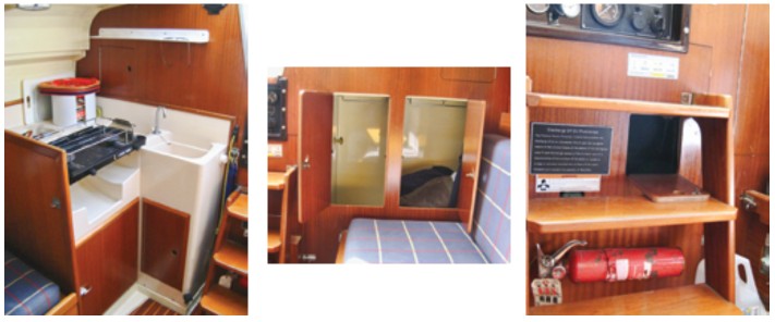 The galley, at left, is a single fiberglass module with the sink and a recess for a gimbaled 2-burner stovetop molded in. The icebox is located under the stove area; side-opening boxes lose cold air much faster than top-opening boxes. The Dufour 27 has a surprising number of storage compartments for its size, including this handy locker aft of the port settee, center. An opening between the companionway steps, at right, allows a fire extinguisher to be discharged into the engine compartment without letting in a lot of oxygen.