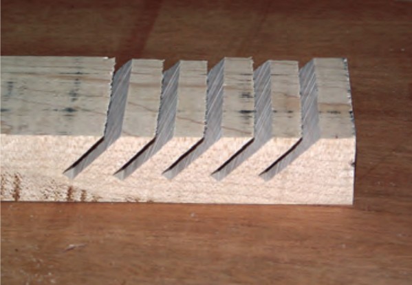 Slat receivers Dan made by ripping the slotted board fit inside the frame.