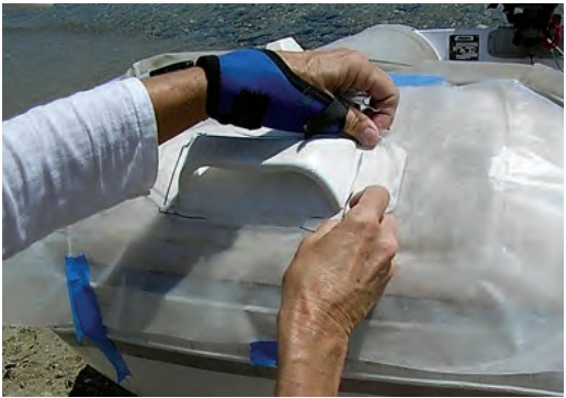 Since the cut edges will not be exact or smooth, extra pieces of plastic are taped as necessary to fine-tune the fit.