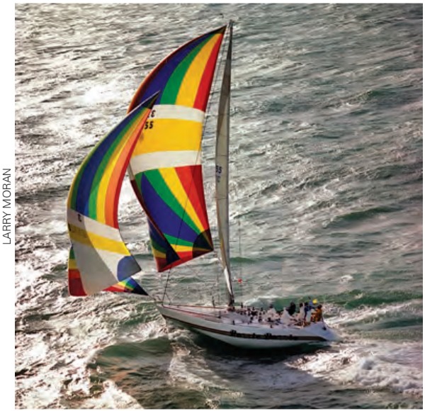 In a typical scene from 1983, Razzle Dazzle is flying a spinnaker and a blooper. Note the big hole in the water amidships . . . into which the boat can easily roll.