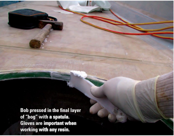 Bob pressed in the final layer of “bog” with a spatula. Gloves are important when working with any resin.