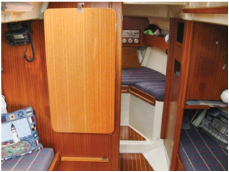 Portions of the hull liners that make up the cabin sole foundation, berth foundations, and hull sides are visible in the forward part of the boat.