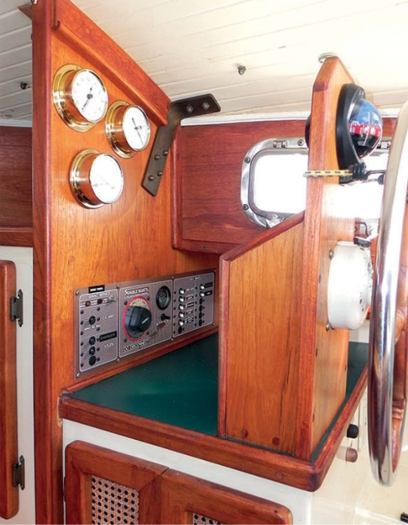 The electric panel is in a cubby forward of the inside wheel. A nice touch is the wicker fronts on the locker doors for ventilation.