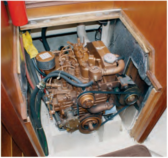 The Universal diesel is easily serviced from the space just beneath the companionway stairs.
