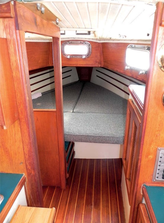 The V-berth is a bit tight for some couples, so one person might sleep on the settee in the pilothouse. The head compartment, tucked to port, offers a modicum of privacy.