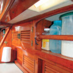 Aboard Nine of Cups, prisms direct daylight into places, like this corner of the galley, that might otherwise be in shadow.
