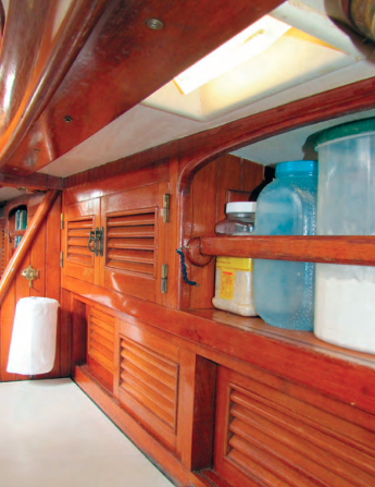 Aboard Nine of Cups, prisms direct daylight into places, like this corner of the galley, that might otherwise be in shadow.