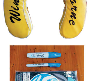 When adhesive-backed vinyl letters refused to stick to the buoy’s vinyl cover, Ferman went to permanent markers and stencils, below.