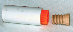 He cut the pipe to that length (2 3/4 inches) and cut the dowel at the same mark.