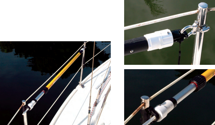 Clarence stows the whisker pole between two stanchions. The spike fits in an eye on one and the snap clips into a shackle strapped to the other.