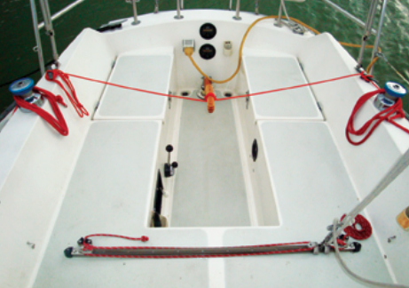 Tiller steering was standard on the Cal 2-27. The mainsheet traveler is mounted on the bridge deck. This is convenient to the helm but can obstruct access to the companionway.