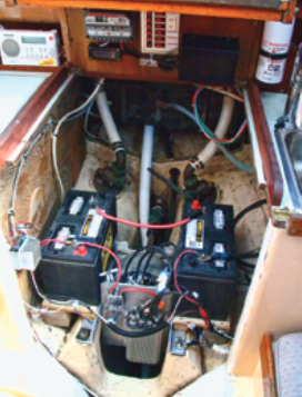 With the electric motor and its support systems in place, Teal’s engine space is still uncrowded. Joe completed the installation by adding hold-downs for the batteries and fitting rubber covers over the high-voltage components.