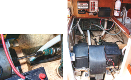 A splined steel shaft extension, attached at each end with clamping couplings, connects the motor’s short shaft to the boat’s original propeller shaft, near right. The installation is compact, with the motor and controller taking up less length than a battery. To prevent contact with the potentially dangerous 48-volt system, Joe made rubber covers for the batteries (two more batteries are under the V-berth), the motor, and the motor controller, far right.