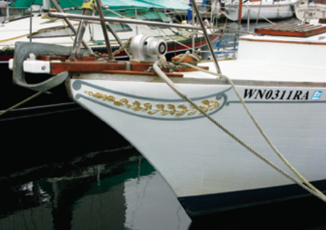 The anchor sprit Richard had installed complements the clipper bow and molded trailboards that give the Ericson Cruising 31 its characteristic appearance.