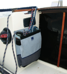 The companionway, recessed into the cabin trunk, is well protected. Here, the removable acrylic doors are closed.