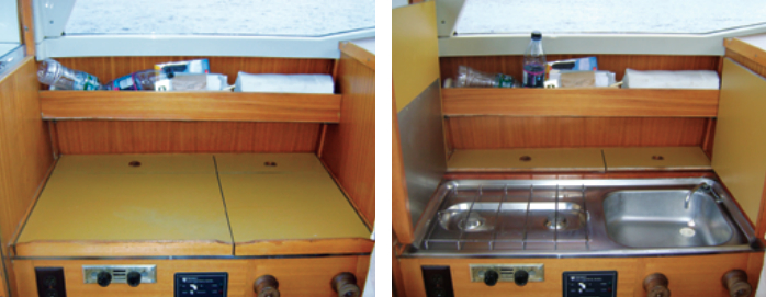 The port side of the pilothouse is both nav station, at left, and galley, at right. When it’s the cook’s turn to use this space, the leaves of the chart table open to reveal a sink with hot and cold running water and a stove.
