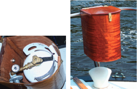 The gas regulator and pressure gauge are inside the locker, at left. The latched lid, at right, keeps out the rain but, to ensure the locker ventilates, it is not airtight.