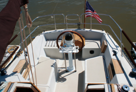 The T-shaped cockpit makes it easier to move around the pedestal and enables the helmsman to stand outboard of the wheel. The downside: seats not long enough to lie down on.