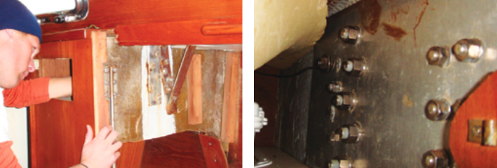 On the starboard side of the Tartan 37, the chainplates for the aft lower shroud and the cap shroud tie into the main bulkhead, at left. The aft lower chainplate, the one that failed on Audentia, is the angular fabrication. Just inboard of it is the cap shroud chainplate, which Andy deemed also suspect. The tie rod, by Andy’s right hand, carries the rigging loads into the hull structure close to the mast step. The chainplates and the tie rod are connected by a single large backing plate on the forward side of the bulkead, inside a locker, at right.