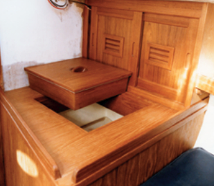 To solve the warm-beer problem, Paul built an efficient icebox (and extra lockers) where the head had been. Although it’s in the forward cabin, it’s conveniently adjacent to the galley counter.