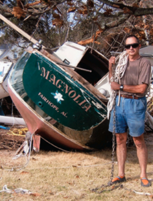 Al Roth, to whom Paul had sold her, stands dejected next to Magnolia where Hurricane Ivan deposited her.