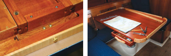 Another view of the underside of the table shows the drawer stop in its groove, at near right. Depressing the end of the stop with a finger allows the drawer to be opened. When Joe uses the table as his navigation desk, he detaches the fiddle, at far right.