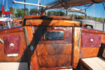 The covers match up on both sides of the companionway. A set of twist-lock fasteners atop the cabin allows the cloths to be unbuttoned at the bottom and. folded up to reveal the instruments when they are needed.