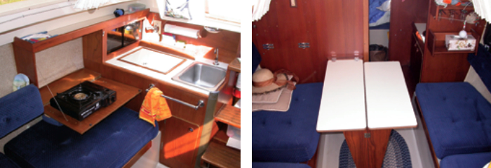 Aboard Martha J., the cooking is done on a portable butane stove. It rests on a panel that folds down to expand the small galley work area, at left. The dinette table mounts on the main bulkhead. Fully opened, it seats four, at right. The starboard leaf folds back to allow passage forward.