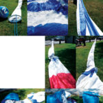 A borrowed lawn and a calm day provide the ideal setting for socking a spinnaker. Lay out the sock and the spinnaker, concertina the sock, and attach the head of the folded spinnaker inside the head of the sock. Pull the sock ring to enshroud the sail, then stuff the sock into the bag so the head and clews go in last.