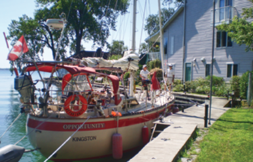 Opportunity's owners, David and Eileen Salter, built her from a bare hull and keep her behind the house they also built, at right.