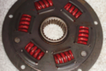 The damper plate is constructed of two plates and springs. The transmission shaft fits into a toothed hole in the center.