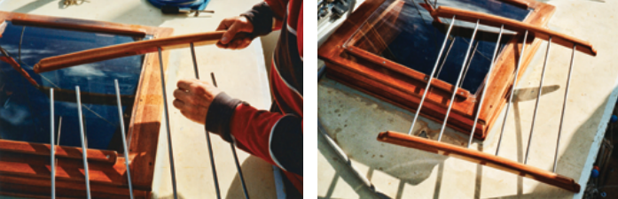 Knowing that varnishing the various parts of the hatch in situ would be difficult, Nick designed the guards to be disassembled. Here, he is fitting the bars into the combs, at left. Once the guard was assembled, at right, he fastened the combs to the hatch from beneath.