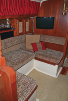 The table (stowed elsewhere) fits between the dinette seats to make a double berth.