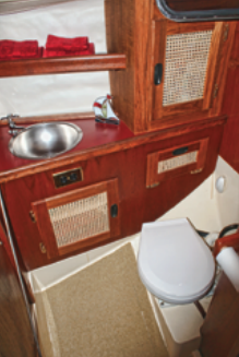 Despite being a tight fit, the head compartment has all the amenities and adequate stowage.