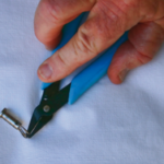 Specially made pliers are tougher than fingernails and better for opening split rings — and they can be had for less than the price of a manicure.