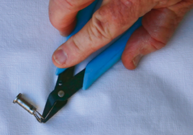 Specially made pliers are tougher than fingernails and better for opening split rings — and they can be had for less than the price of a manicure.
