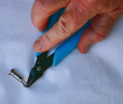 Specially made pliers are tougher than fingernails and better for opening split rings — and they can be had for less than the price of a manicure.